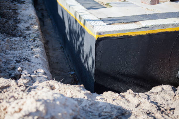 Professional Waterproofing technician working in Riverdale, MI